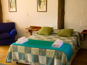 Ένα ή περισσότερα κρεβάτια σε δωμάτιο στο Hotel Cinaruco Caney