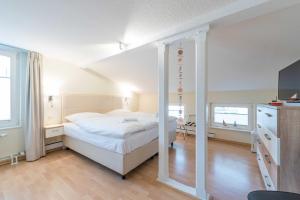 Postel nebo postele na pokoji v ubytování Haus am Meer Wintergarten PH 7, 2 SZ, strandnah by Unsere Urlaubszeit