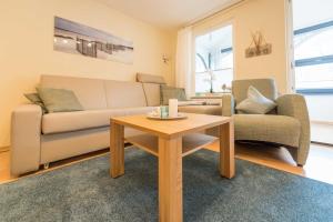 Posezení v ubytování Haus am Meer Wintergarten PH 7, 2 SZ, strandnah by Unsere Urlaubszeit