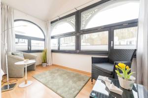 Posezení v ubytování Haus am Meer Wintergarten PH 7, 2 SZ, strandnah by Unsere Urlaubszeit