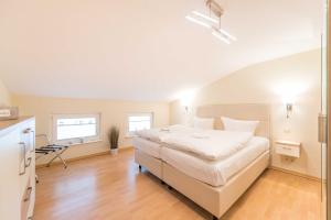 Postel nebo postele na pokoji v ubytování Haus am Meer Wintergarten PH 7, 2 SZ, strandnah by Unsere Urlaubszeit