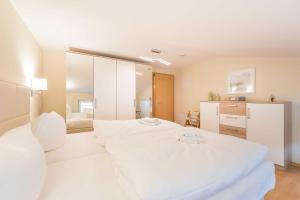 Postel nebo postele na pokoji v ubytování Haus am Meer Wintergarten PH 7, 2 SZ, strandnah by Unsere Urlaubszeit
