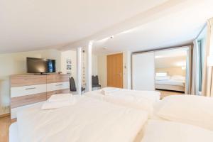 Postel nebo postele na pokoji v ubytování Haus am Meer Wintergarten PH 7, 2 SZ, strandnah by Unsere Urlaubszeit