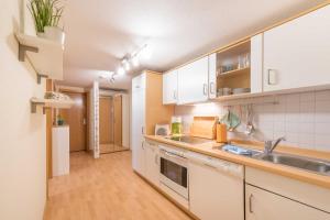 Kuchyň nebo kuchyňský kout v ubytování Haus am Meer Wintergarten PH 7, 2 SZ, strandnah by Unsere Urlaubszeit