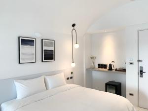 Letto o letti in una camera di Little Greece