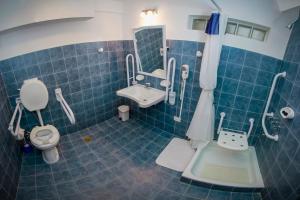 Koupelna v ubytování Melewe Apart hotel Caviahue + 36 fotografií
