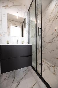 a bathroom with a sink and a mirror at MBM - LOFT MARAIS in Paris