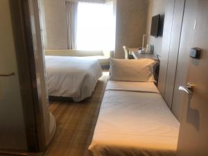 Katil atau katil-katil dalam bilik di Holiday Inn Express Hong Kong Mongkok by IHG