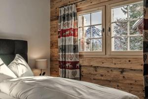 Postel nebo postele na pokoji v ubytování Alpslodge - Amelia