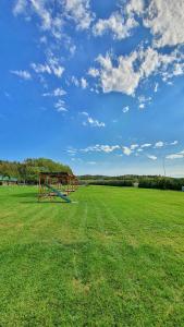 a park with a playground in the middle of a field at Vu-Dent Apartments in Gevgelija