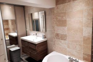 a bathroom with a sink and a toilet and a mirror at La casa pétillante ! in Ay +19 photos