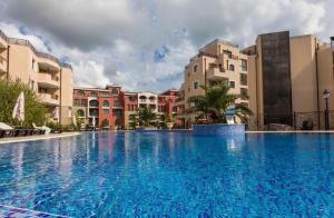 a large swimming pool in front of some buildings at Premium complex Millennium 2 - Family apartment & Spa in Sveti Vlas