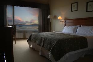 Cama ou camas em um quarto em Terrazas Del Calafate