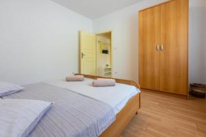 Postel nebo postele na pokoji v ubytování Apartments Anica