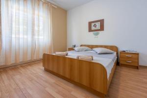 Postel nebo postele na pokoji v ubytování Apartments Anica