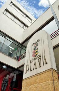 a sign in front of a building at Hotel Boyaca Plaza in Tunja