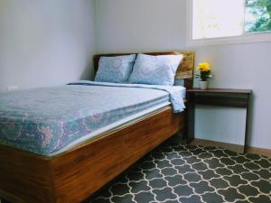 Кровать или кровати в номере Kali Hostal