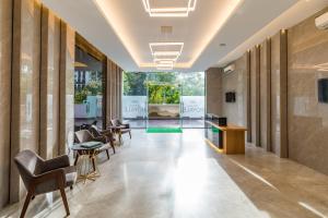a lobby of a building with chairs and tables at AR Suites Jewels Royale - Koregaon Park NX in Pune