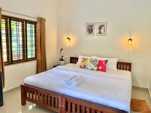 Flower Valley Plantation Homestay客房内的一张或多张床位