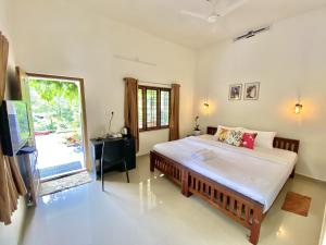 Flower Valley Plantation Homestay客房内的一张或多张床位