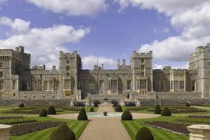 a large castle with a garden in front of it at Windsor Town Centre Victorian townhouse sleeps 6 in Windsor