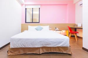 Postel nebo postele na pokoji v ubytování Yi Le Homestay