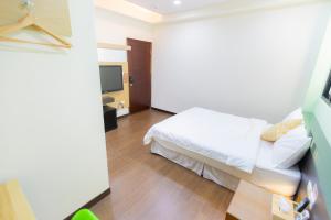 TV a/nebo společenská místnost v ubytování Yi Le Homestay