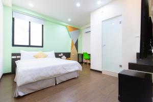 Postel nebo postele na pokoji v ubytování Yi Le Homestay