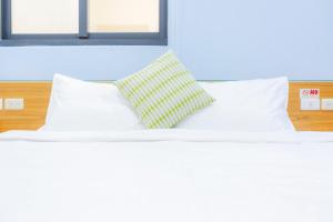 Postel nebo postele na pokoji v ubytování Yi Le Homestay