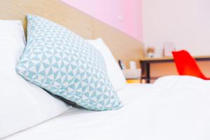 Postel nebo postele na pokoji v ubytování Yi Le Homestay