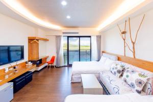 Posezení v ubytování Yi Le Homestay