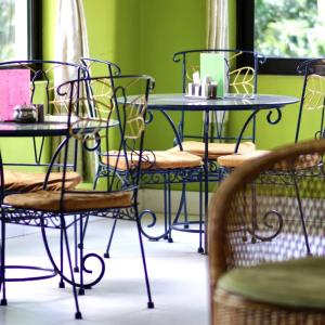 a group of tables and chairs in a room at Monkey Bunky-3Monkeys Backpacker's Hostel in Kathmandu