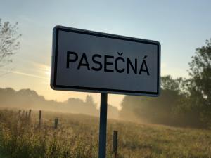 a white sign with the word pastaeria on a field at Penzion Dobík Pasečná in Přední Výtoň