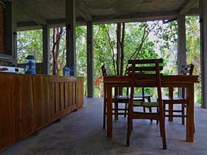 a dining room with a table and two chairs at The Hideaway in Kurunegala