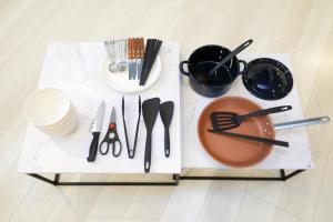 a table with utensils on top at AQA ART 江の島 in Fujisawa