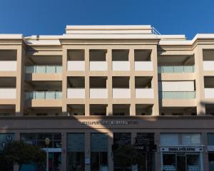 an office building with the front of the building at Rhodes Central Suite in Rhodes Town