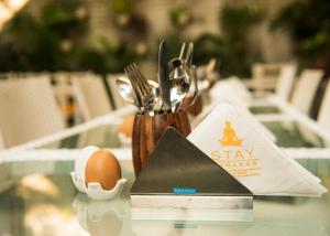 a table topped with an egg and a star wars sidx sidx sidx at Stay Banaras - A Boutique Hotel in Sigra in Varanasi