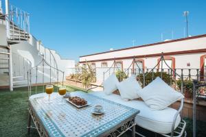 A balcony or terrace at Maestranza Boutique