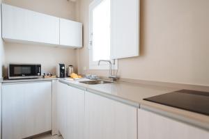A kitchen or kitchenette at Maestranza Boutique