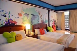 Voodi või voodid majutusasutuse Yoho Beach Resort Kenting toas