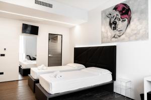 Säng eller sängar i ett rum på PALAZZO CIOTTI