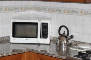 A kitchen or kitchenette at Dimora Re di Roma - Rome Apartment