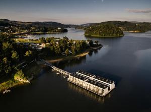 an aerial view of a dock on a lake at Lemon Resort Spa in Gródek Nad Dunajcem