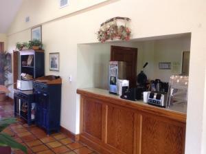 a coffee shop with a counter and a counter sidx sidx sidx at Countryside Inn in Wharton