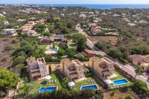 an aerial view of a villa in a resort at Son Ganxo iii in Cala Murada