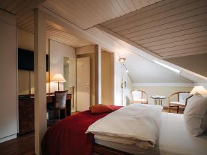 Ліжко або ліжка в номері Hotel Krone Thun