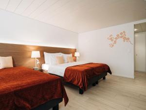 Ліжко або ліжка в номері Hotel Krone Thun
