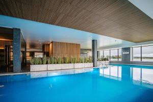 a large swimming pool in a hotel room at Hestia Hotel Haapsalu SPA in Haapsalu