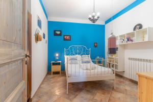 מיטה או מיטות בחדר ב-Villa Romitello con Piscina Total Relax