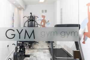 a sign that reads gym gym gym in a room at Erato Hotel in Agia Marina Aegina